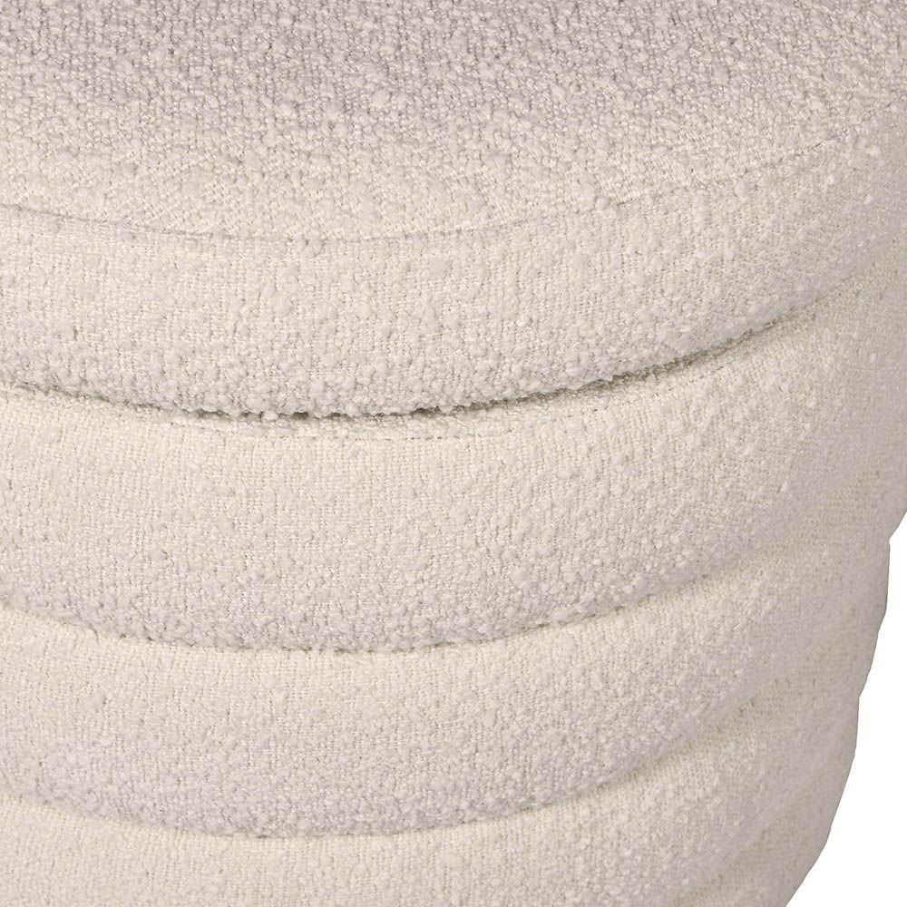 A luxurious boucle cream upholstered ottoman with storage space