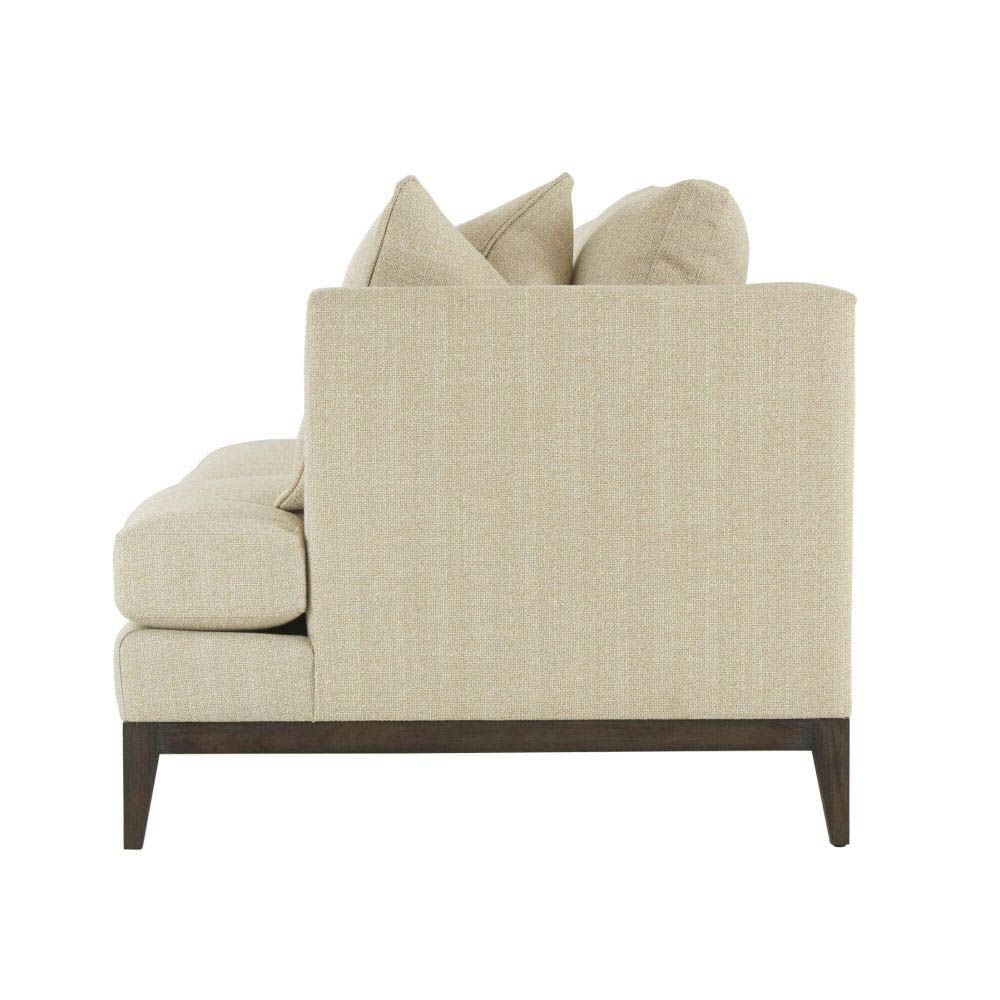 Natural upholstered three seater sofa with dark brown wooden legs