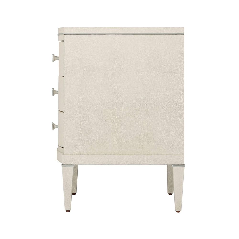 A luxury bedside table by Theodore Alexander with a shagreen embossed leather design