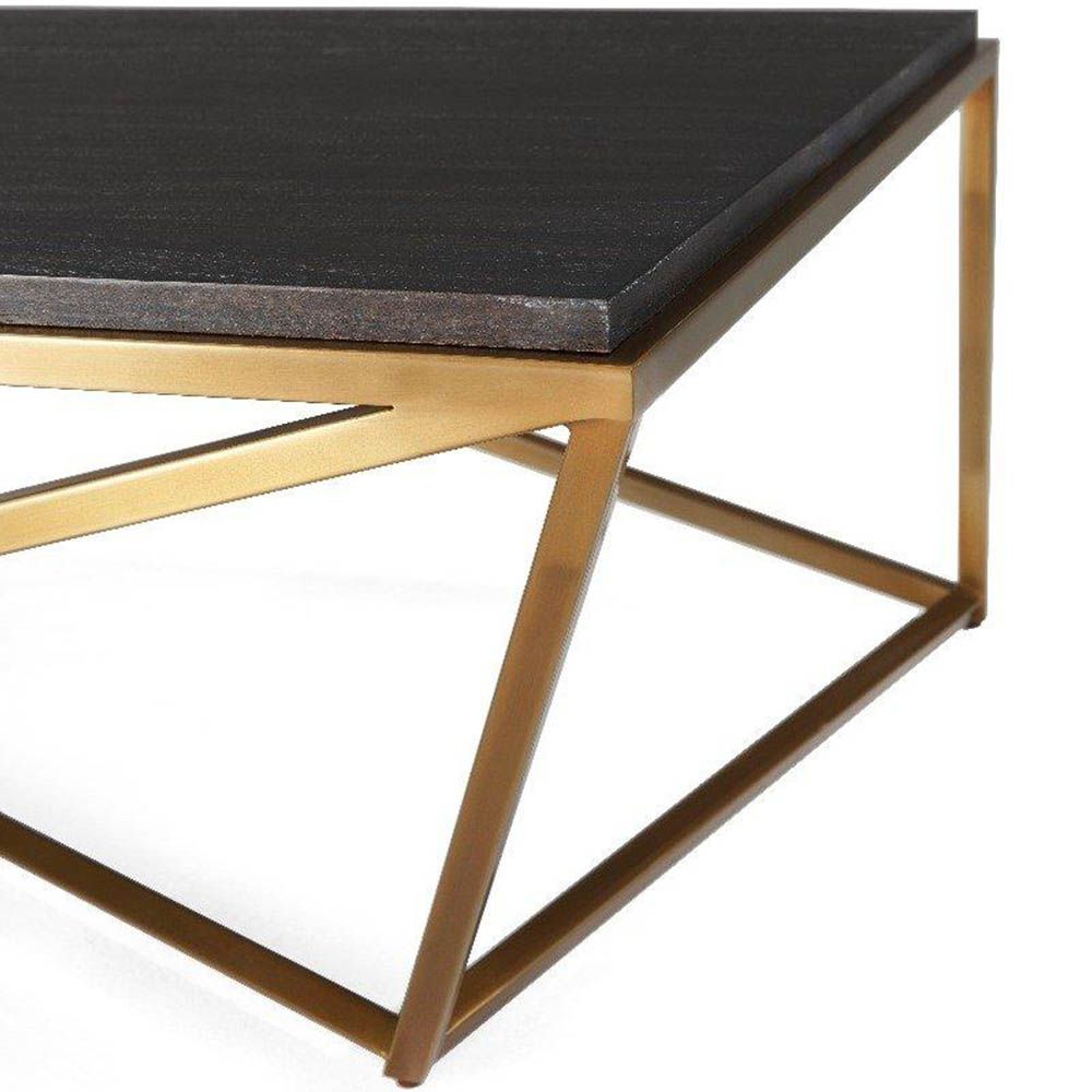 Contemporary coffee table with brass base and black top 