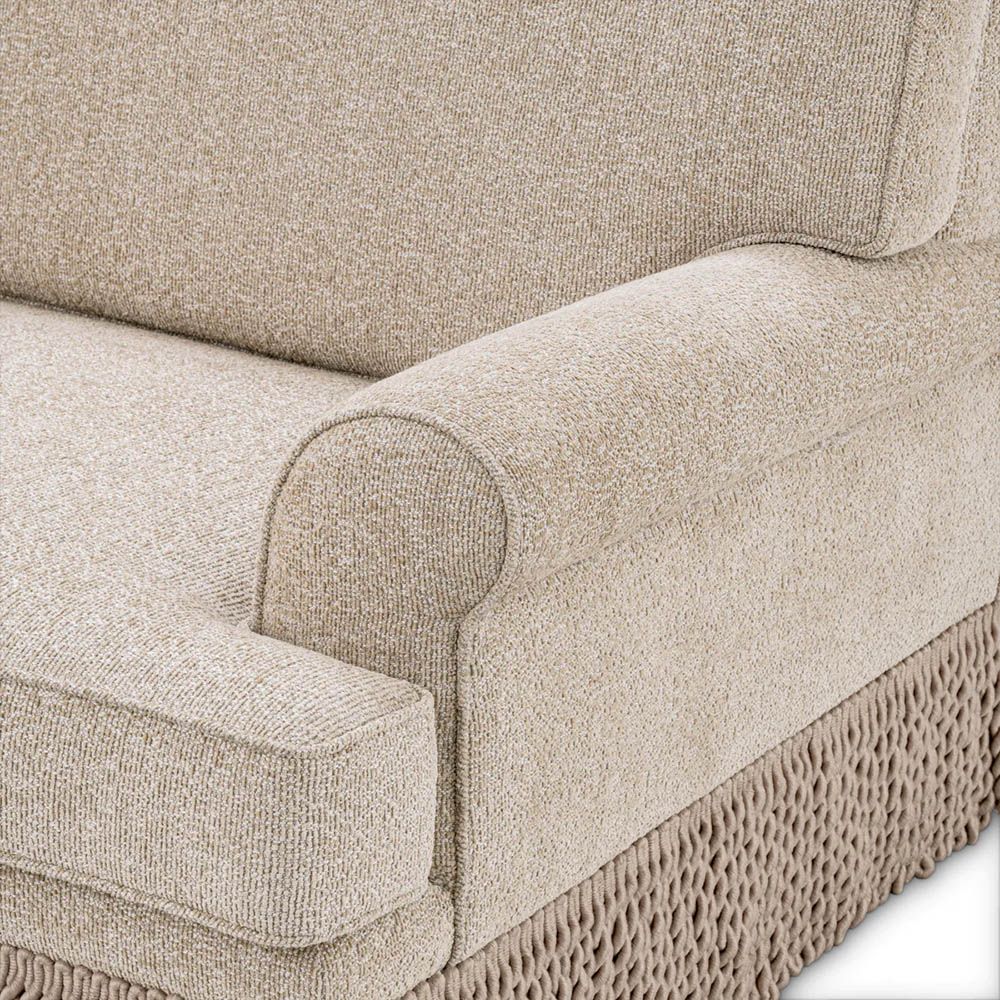 Cream sofa with twill detail surrounding the bottom