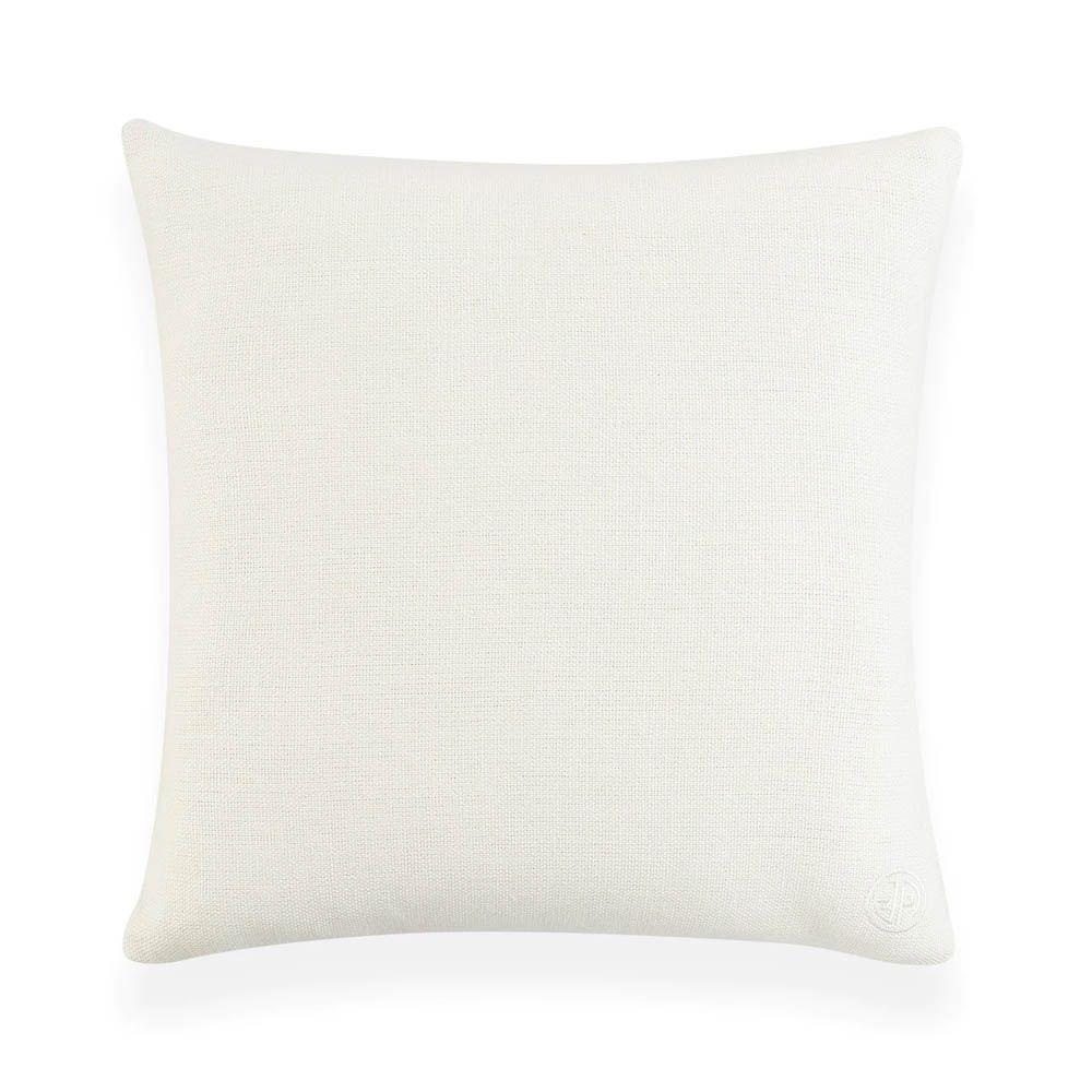 White cushion with black wavy shape and two orange circles