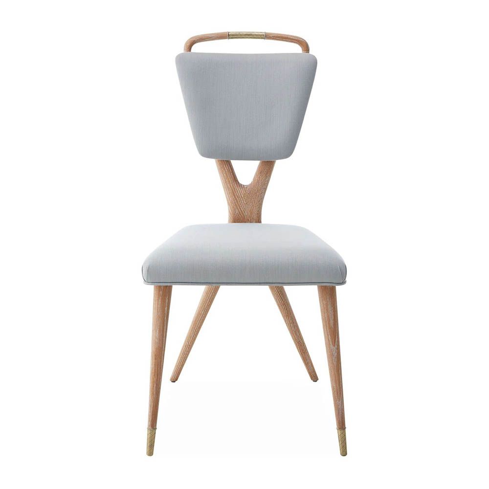 A stylish dining chair by Jonathan Adler with a unique design