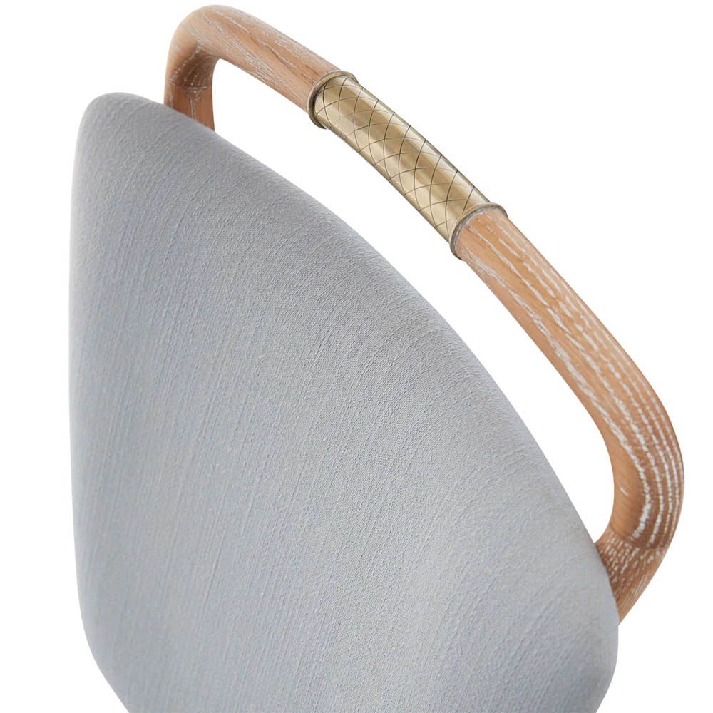 A stylish dining chair by Jonathan Adler with a unique design