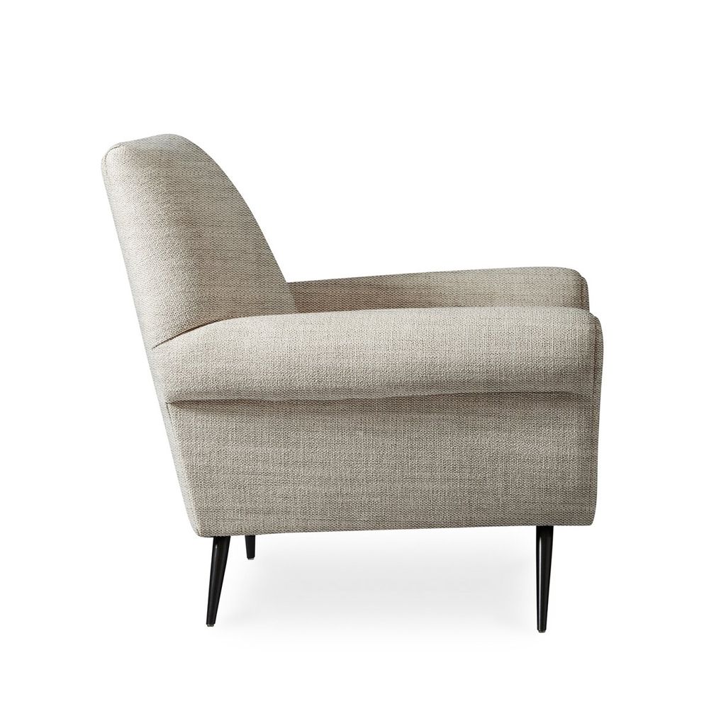 A luxurious natural-toned armchair with black tapered legs