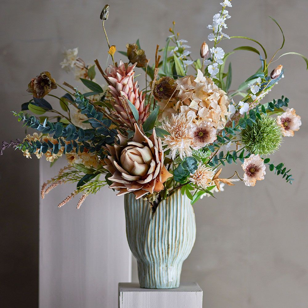 Green vase with shaded details and blooming petal shape