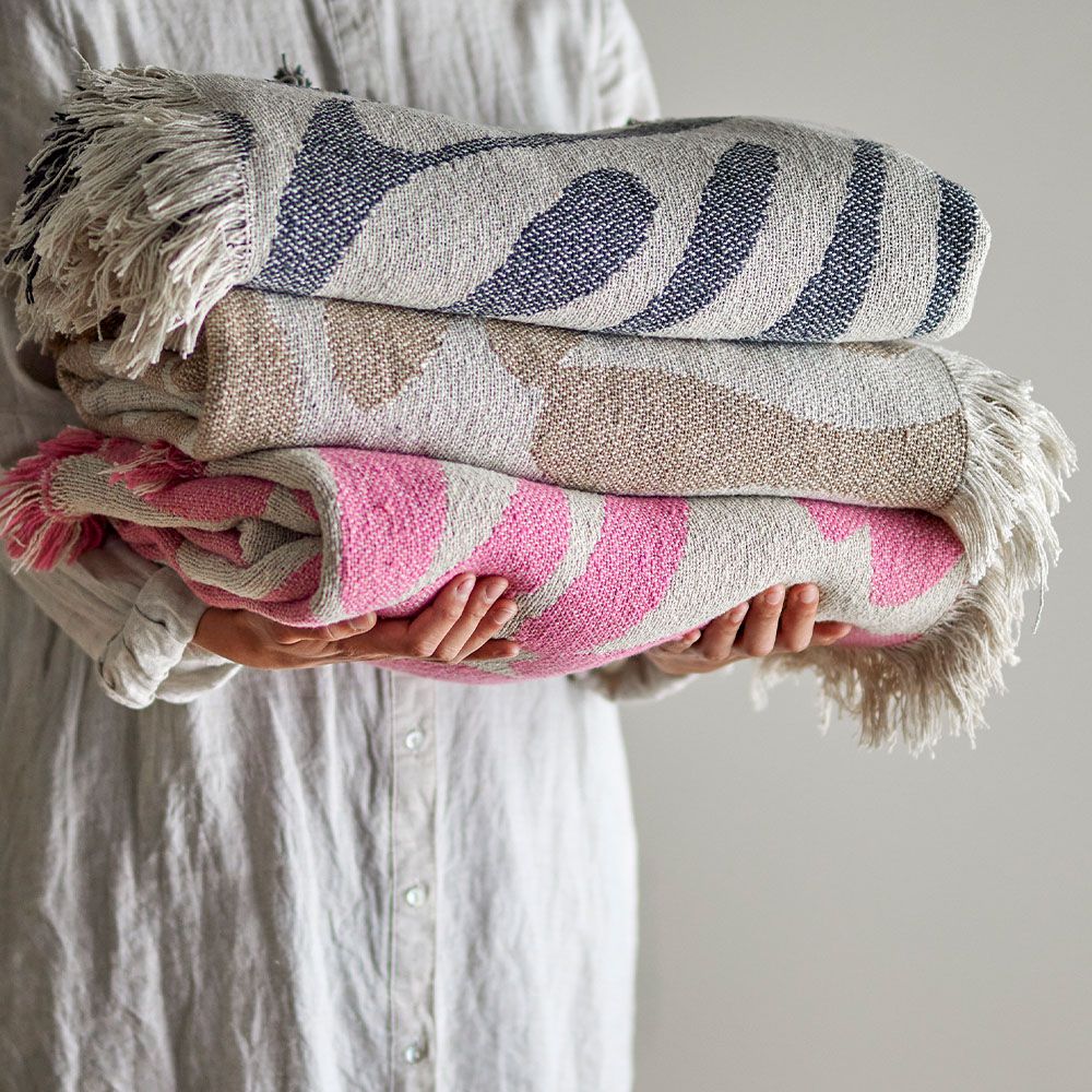 Pink and cream throw with fringing details