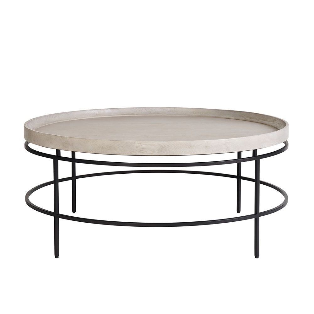 Round coffee table with a black metalwork frame and pale edged top