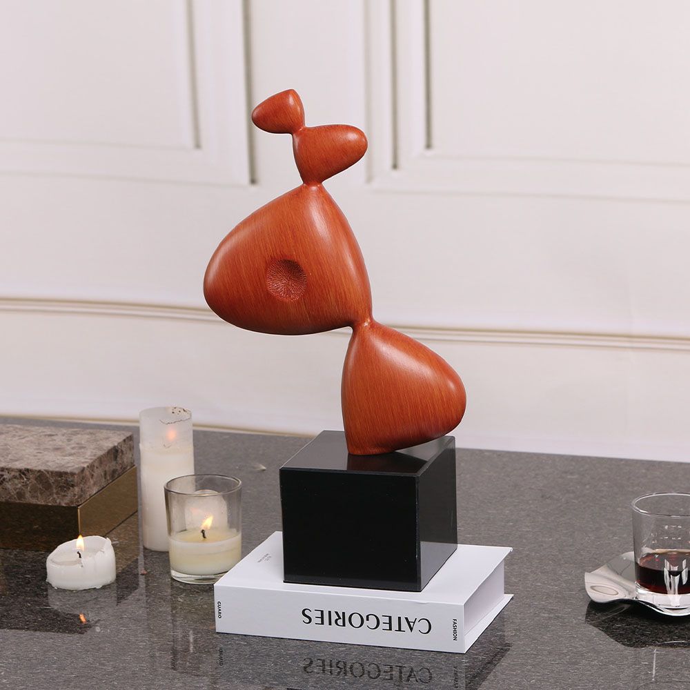 Captivating sculpture composed of red resin and sleek black marble