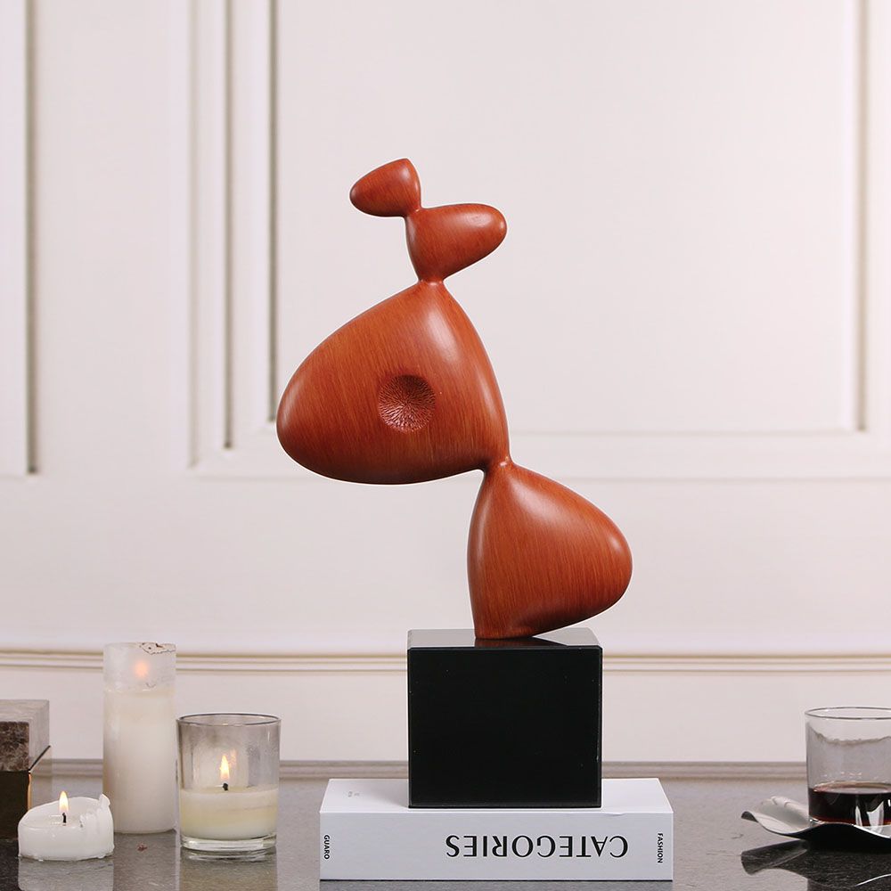 Captivating sculpture composed of red resin and sleek black marble