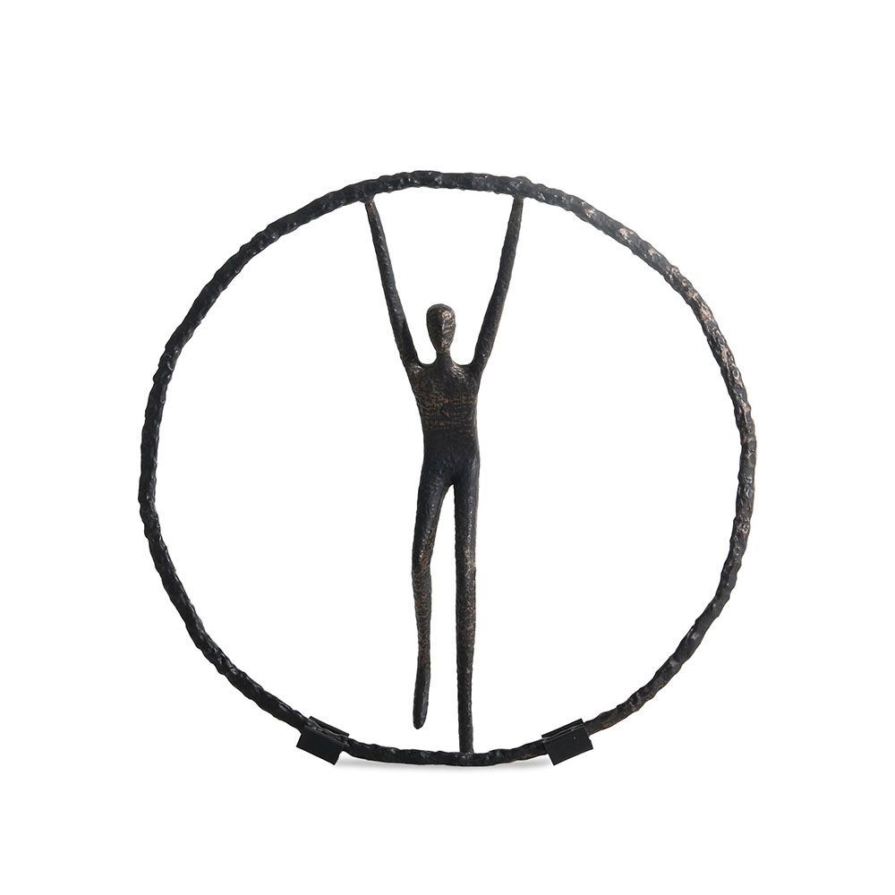 Black zinc alloy sculpture featuring person balancing in circle