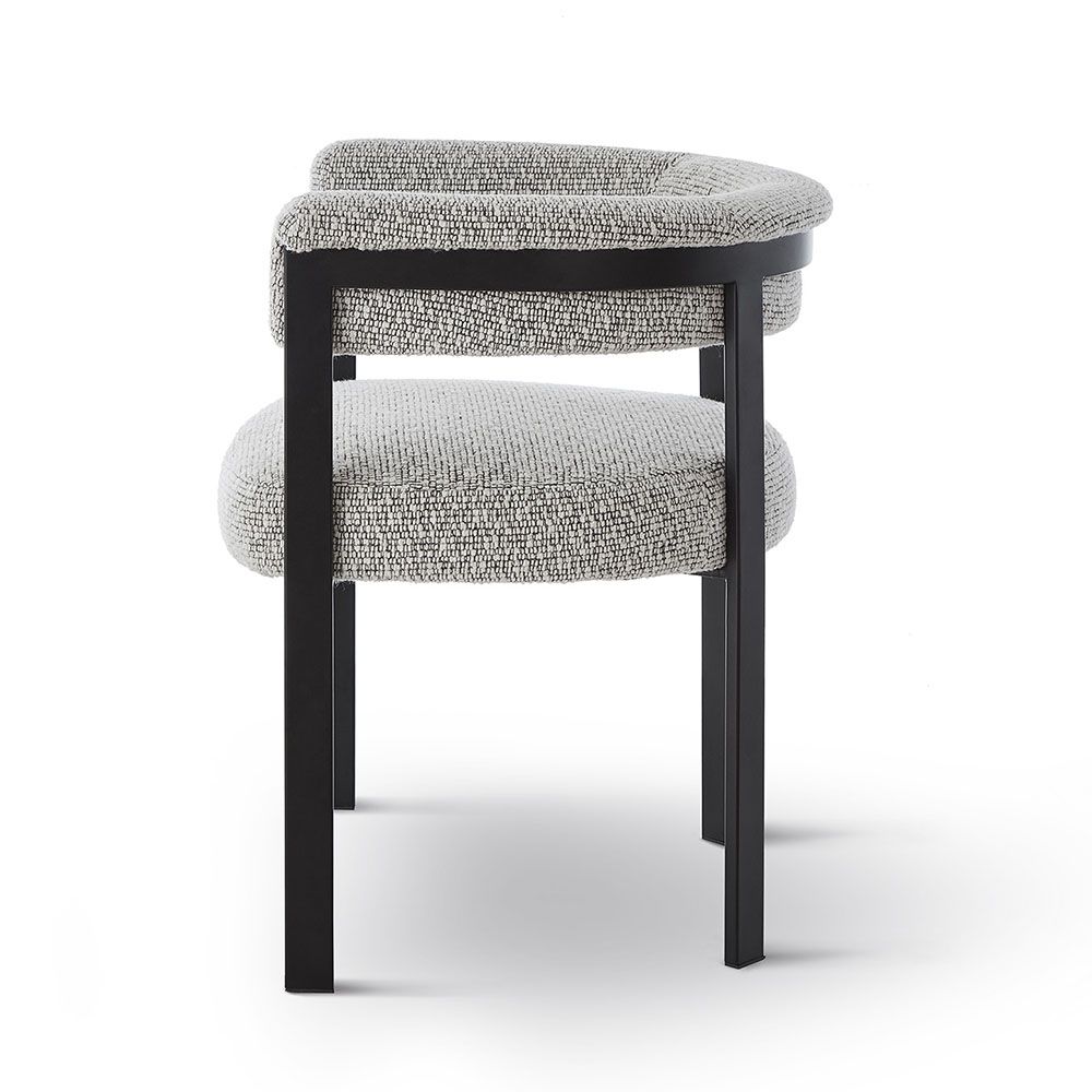 Elegant boucle upholstered dining chair in grey with black frame