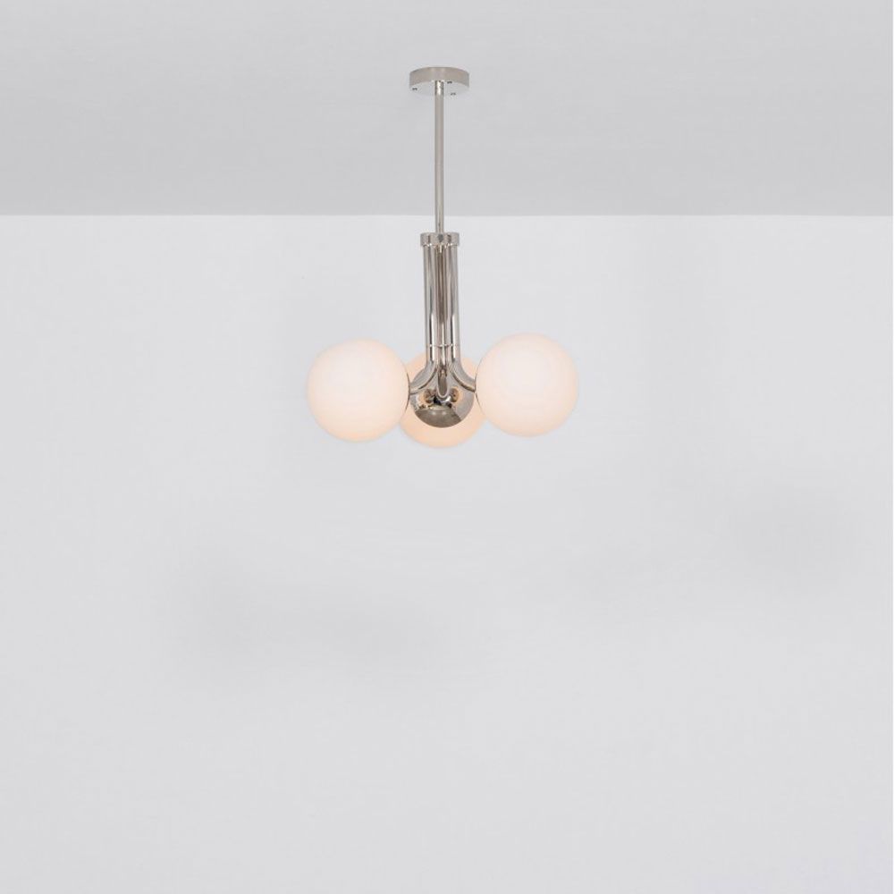A chic, early century inspired LED pendant with translucent opal globes