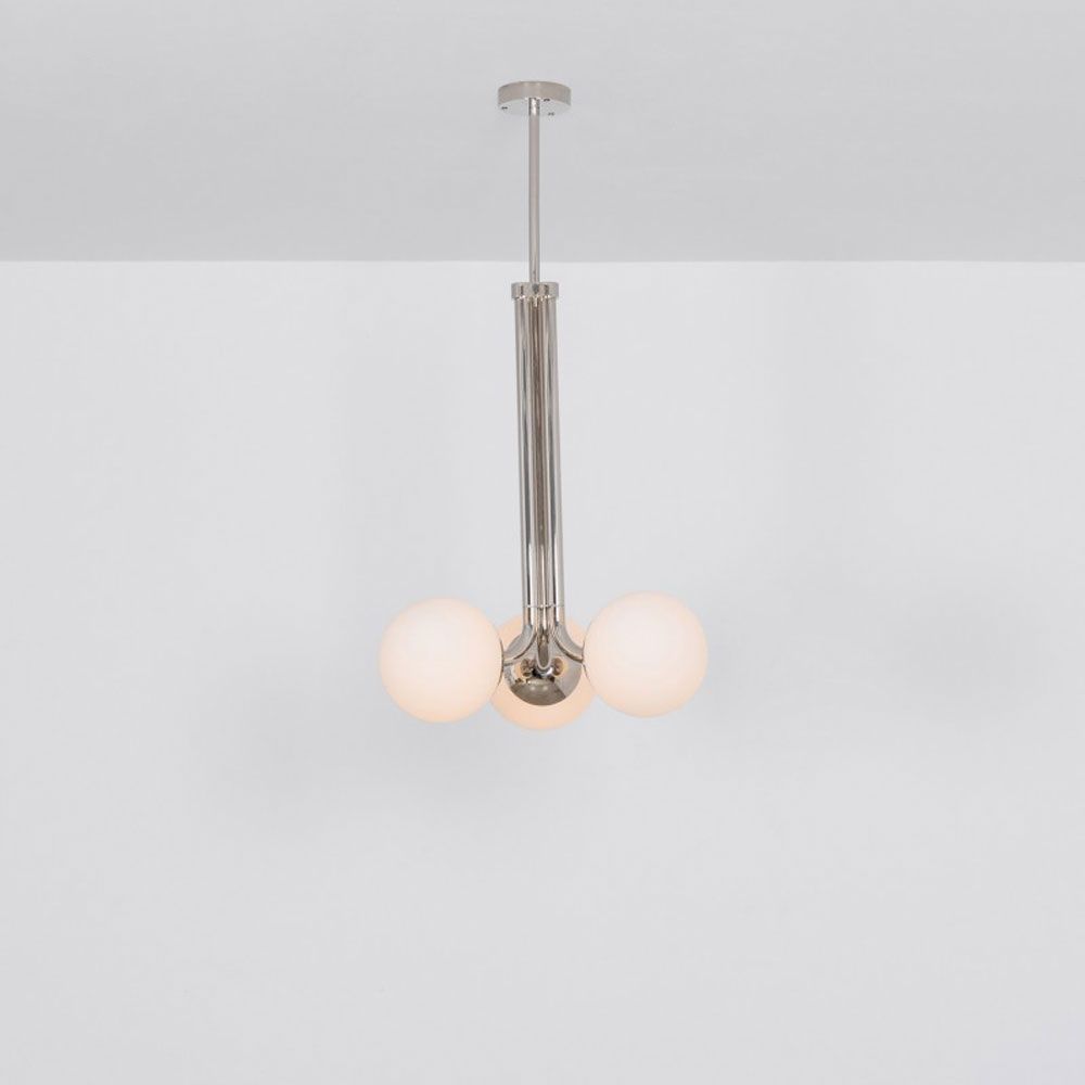 A glamorous polished nickel ceiling pendant inspired by early century and industrial style 
