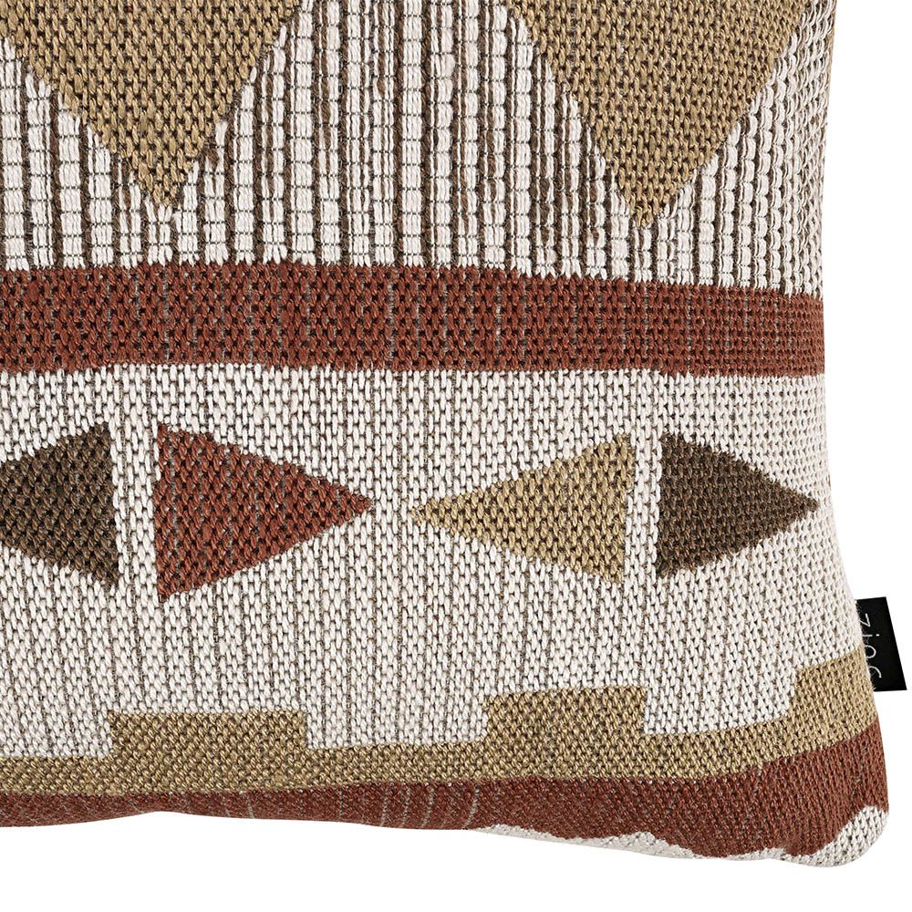 Woven cushion with playful display of geometric design 