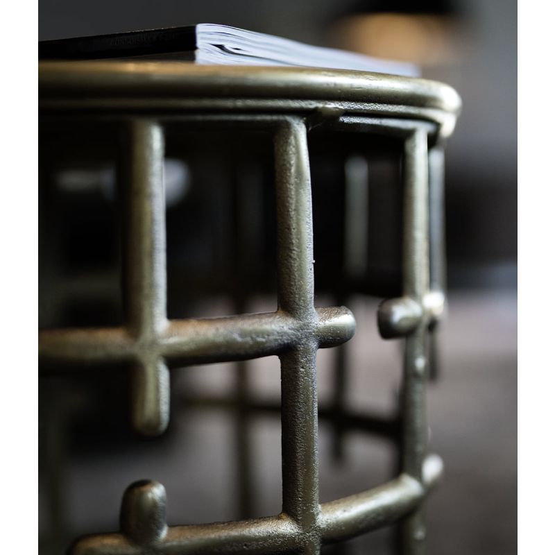 Side table with geometric design in vintage brass