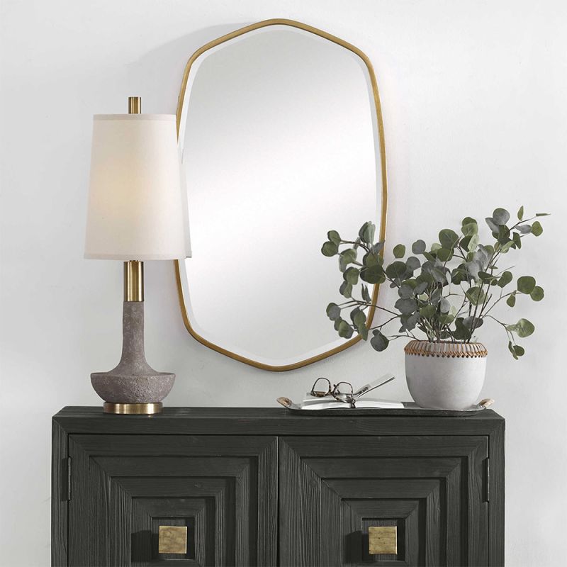 A gorgeous wall mirror by Uttermost with a golf leaf finish