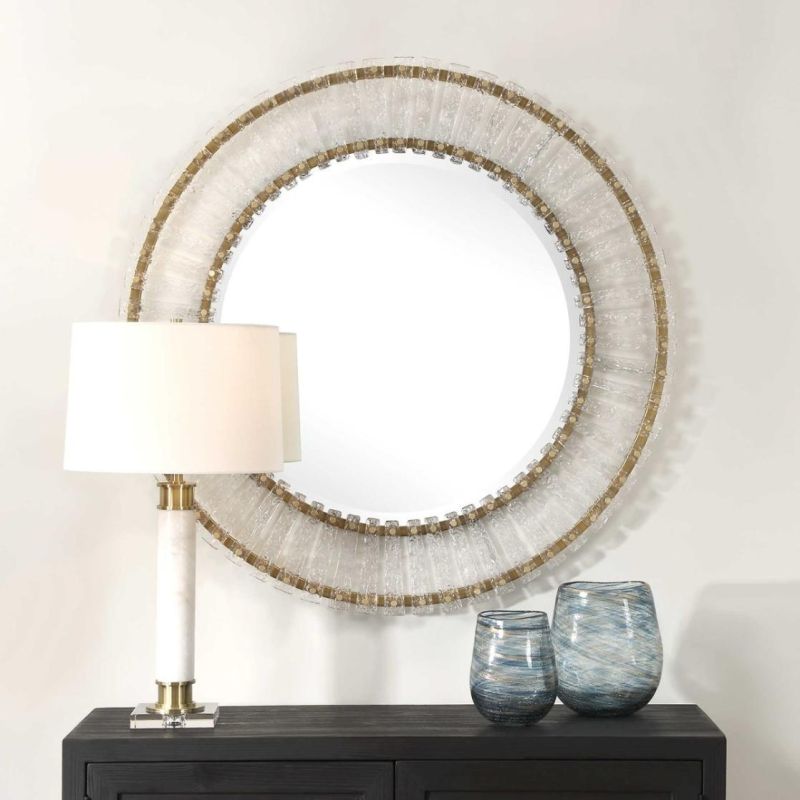 Round mirror with glass panelled framed with brass accents