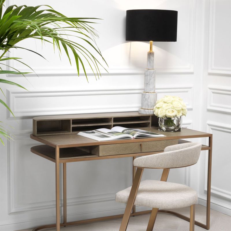 A contemporary desk by Eichholtz crafted from oak with a beautiful brass frame 