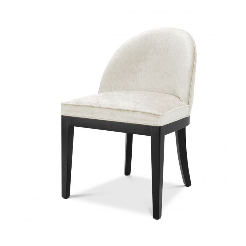 A stylish off-white dining chair with contrasting black legs