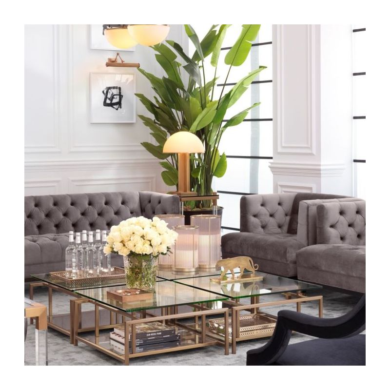 Mushroom-shaped table lamp with gold base and off white domed top