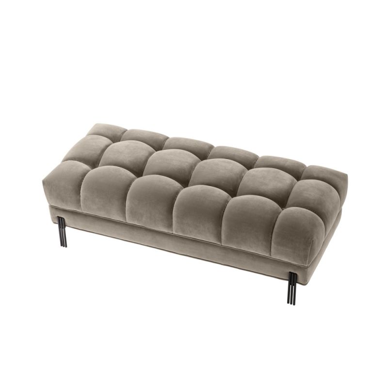 A luxurious deep-buttoned velvet bench with black legs