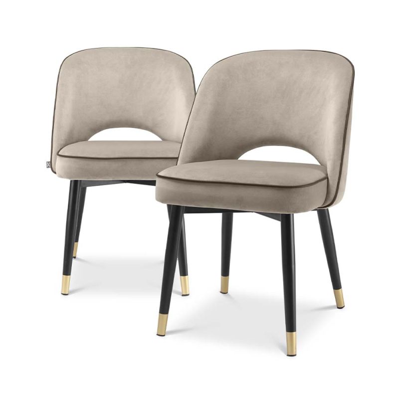 Classic and chic set of 2 dining chairs from Eichholtz upholstered in a greige velvet fabric