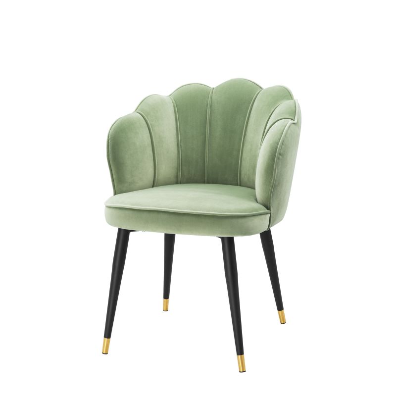 a gorgeous pale green dining chair with gold-capped tapered legs 