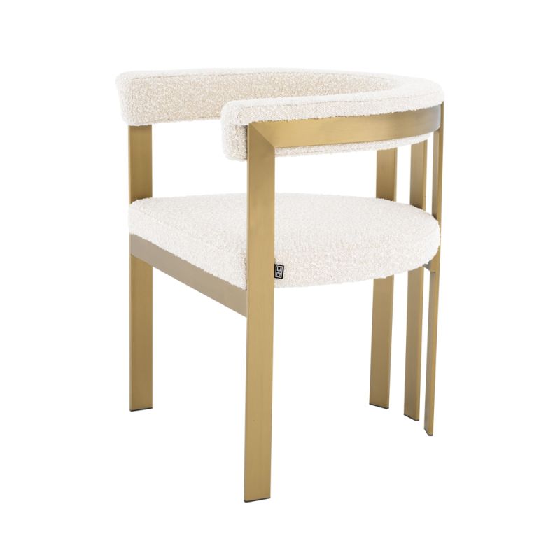 boucle upholstered chair with brushed brass frame