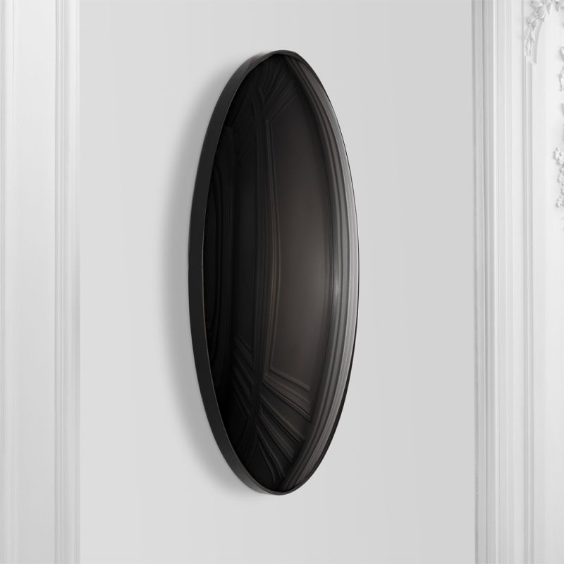 A luxurious round wall mirror with a black convex surface