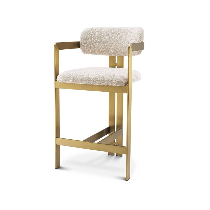 Glamorous counter stool with brushed brass frame and boucle cream upholstery.