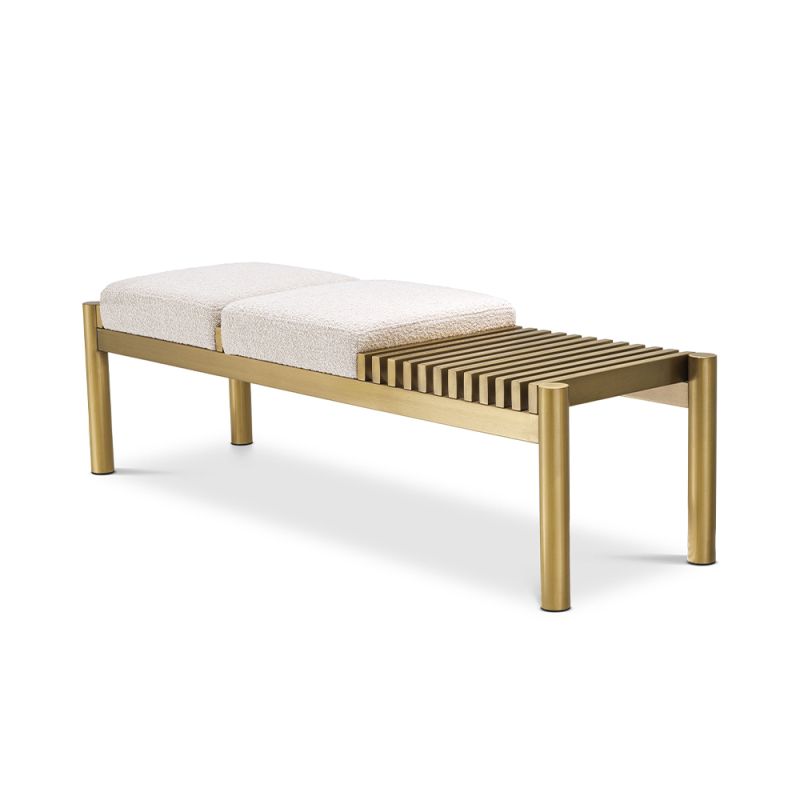 A glamorous bench by Eichholtz with two dreamy boucle cream upholstered seats and a beautiful brushed brass finish