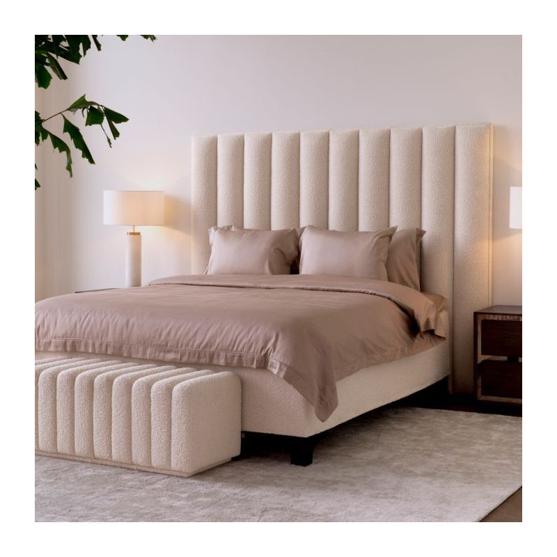The Ditmar Headboard, upholstered in Bouclé cream fabric with deep channel stitching, creates a sophisticated dimensional effect with its clean lines and vertical sections.