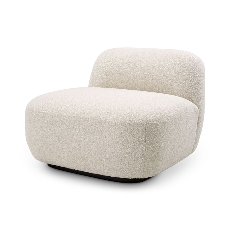 A sumptuous chair by Eichholtz with a lovely boucle cream upholstery and a contrasting black base
