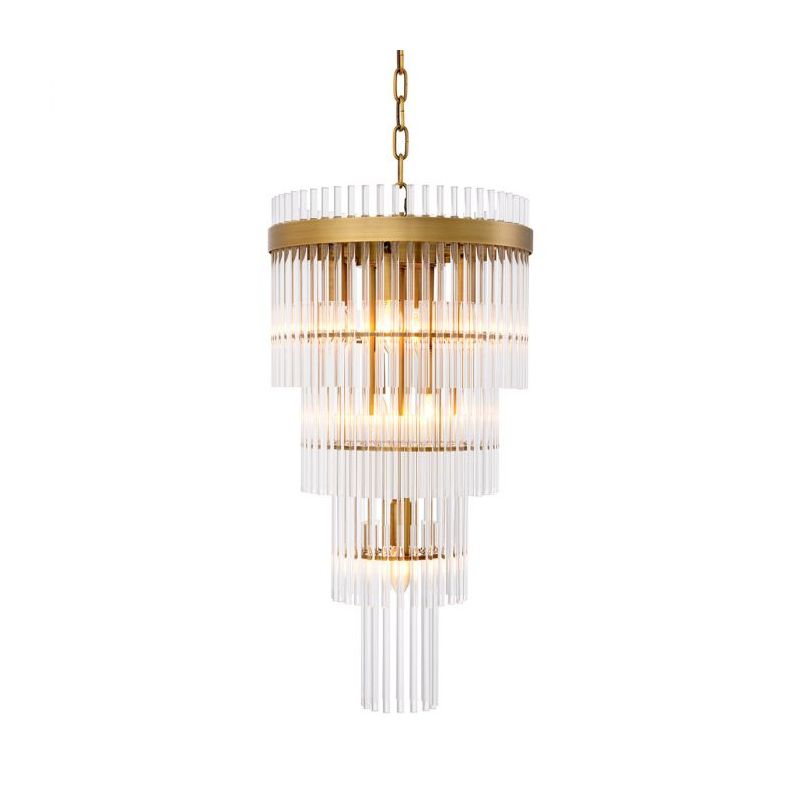 The Yara Chandelier, with clear glass tubes arranged in a stunning waterfall effect on an antique brass frame, offers adjustable height for a custom touch.