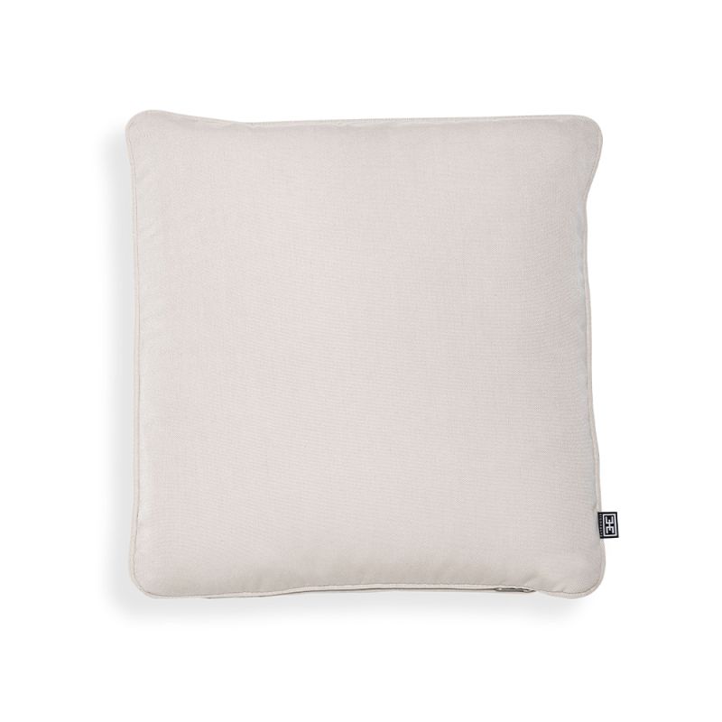 A luxury outdoor cushion by Eichholtz with an off-white canvas cover 