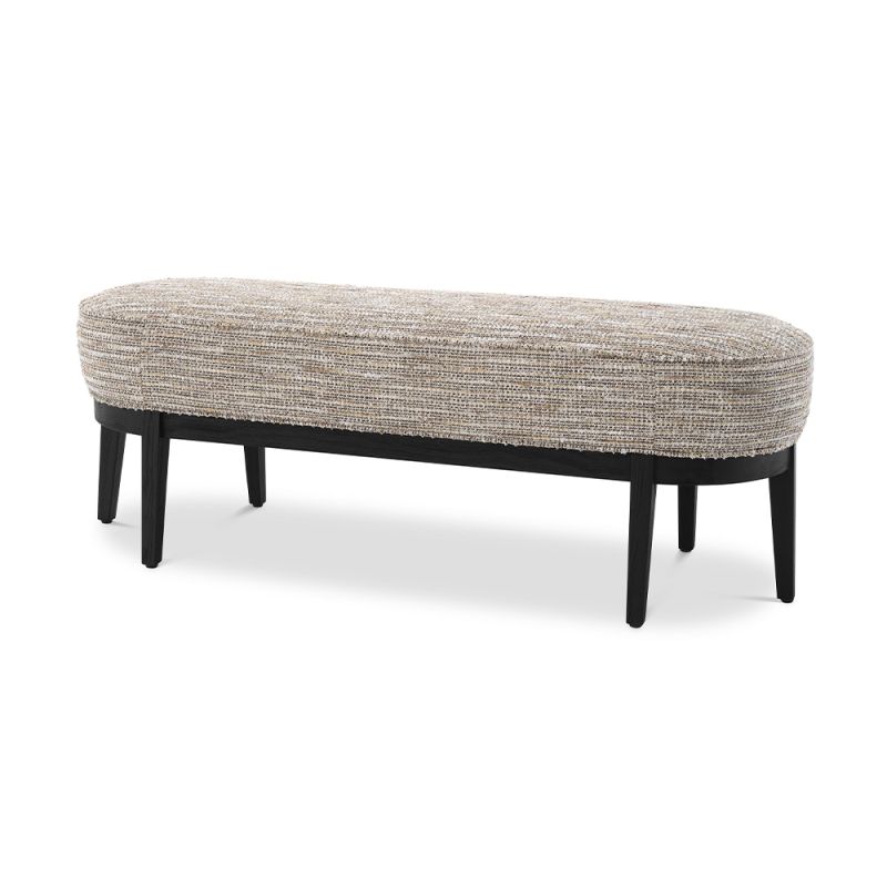 A luxurious bench by Eichholtz with a Mademoiselle beige upholstery and a black finished base