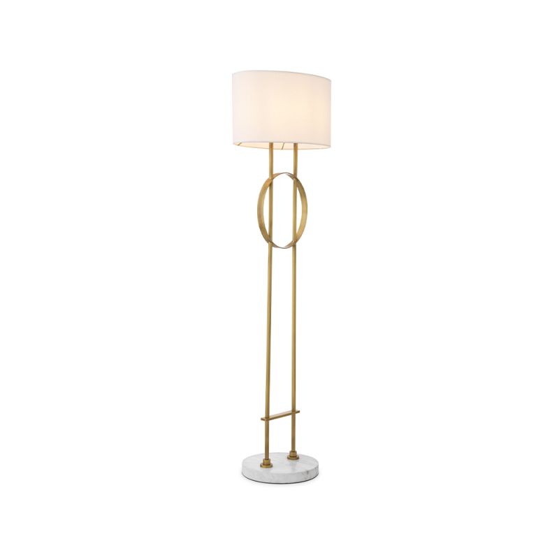 A luxurious floor lamp by Eichholtz with an antique brass base finished with a circular white marble plinth and off-white shade