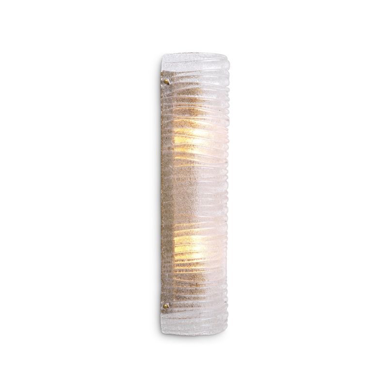 A gorgeous wall lamp by Eichholtz with a modern design and vintage brass finish with a ribbed clear glass shade