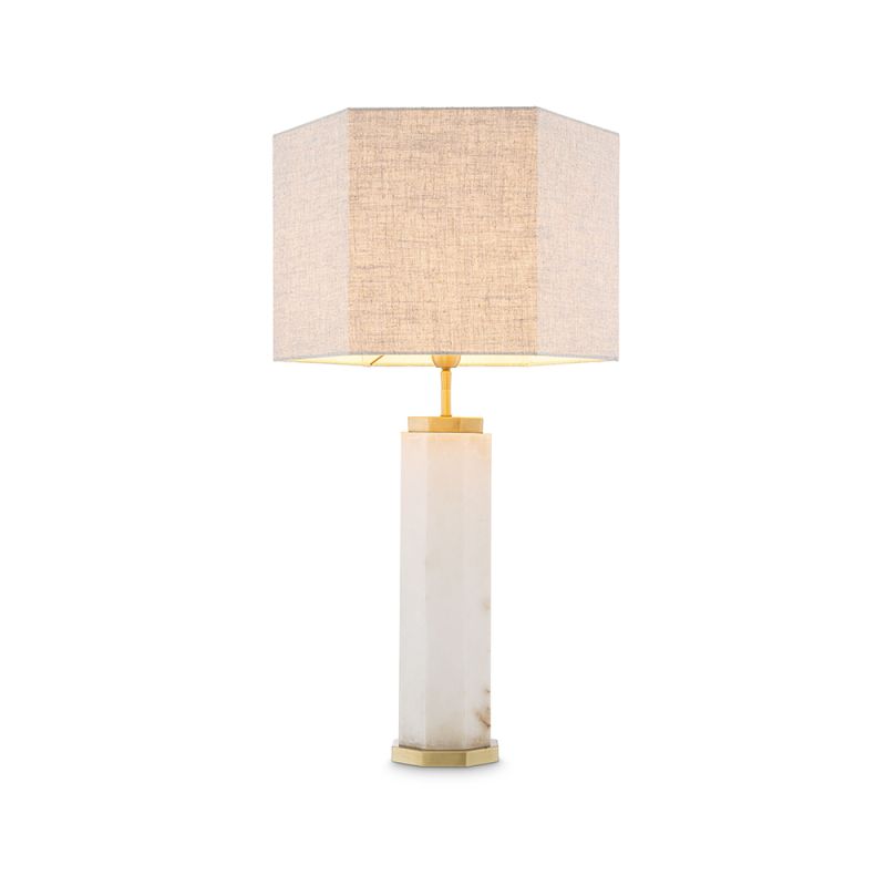 A glamorous side lamp by Eichholtz with an antique brass finish, octagonal alabaster body and linen mix lampshade