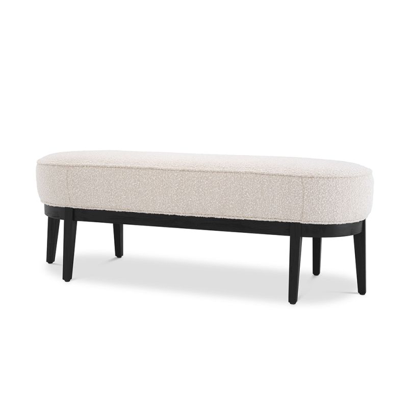 An elegant bench by Eichholtz with a luxury bouclé cream upholstery and beautiful black finished frame