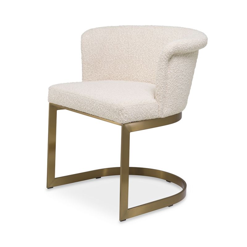 Modern, boucle upholstered dining chair with brushed brass base