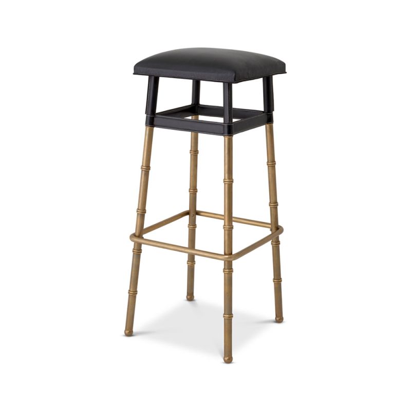 A stylish bar stool by Eichholtz with a black leather and vintage brass finish