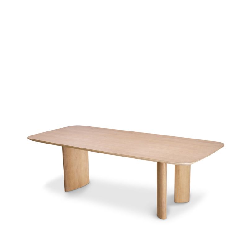 A natural oak veneer dining table by Eichholtz featuring subtle asymmetrical table legs