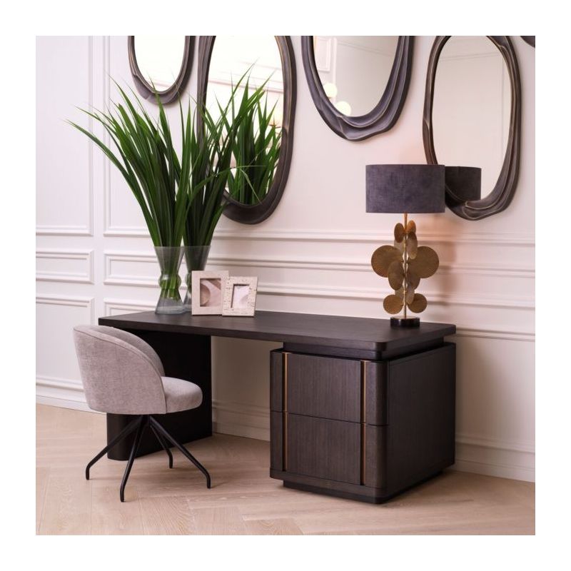 The Modesto Desk, crafted from mocha oak veneer with brushed brass accents, blends rustic charm and contemporary style, offering a spacious, elegant work surface.