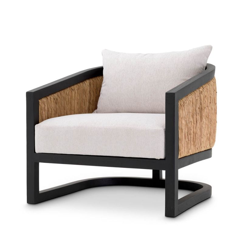 Gorgeous natural rattan back armchair with black frame and cream seat and back cushions
