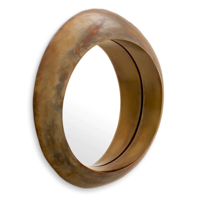 Vintage brass round mirror boasting sleek circular form