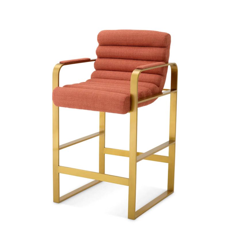 orange linen upholstered counter stool with horizontal fluting and brass frame