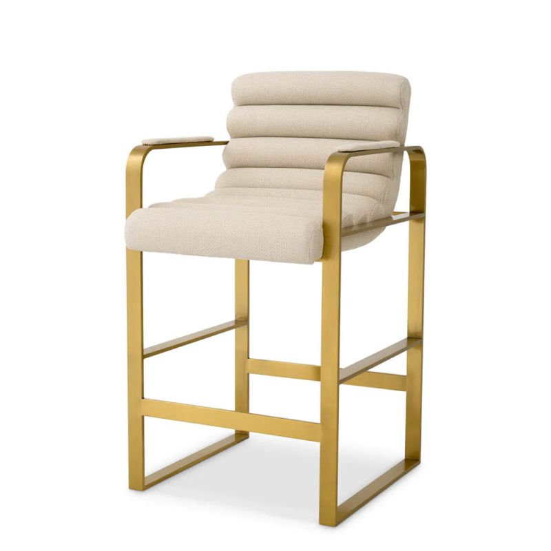 cream linen upholstered counter stool with horizontal fluting and brass frame