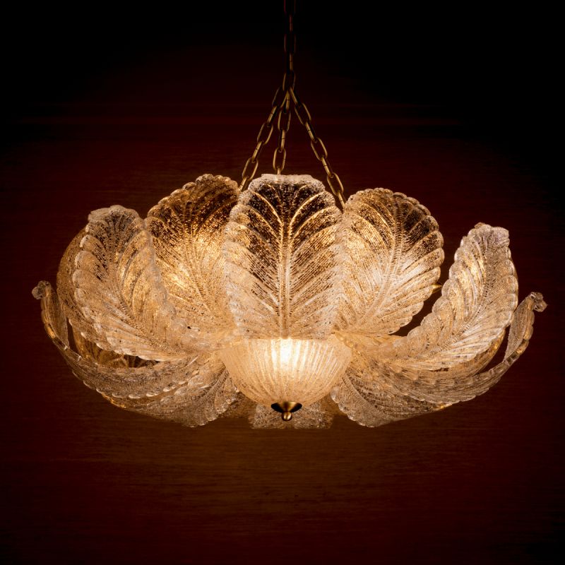 The Cabrillo Chandelier combines textured glass and an antique brass finish, offering a timeless and sophisticated statement for your interior.